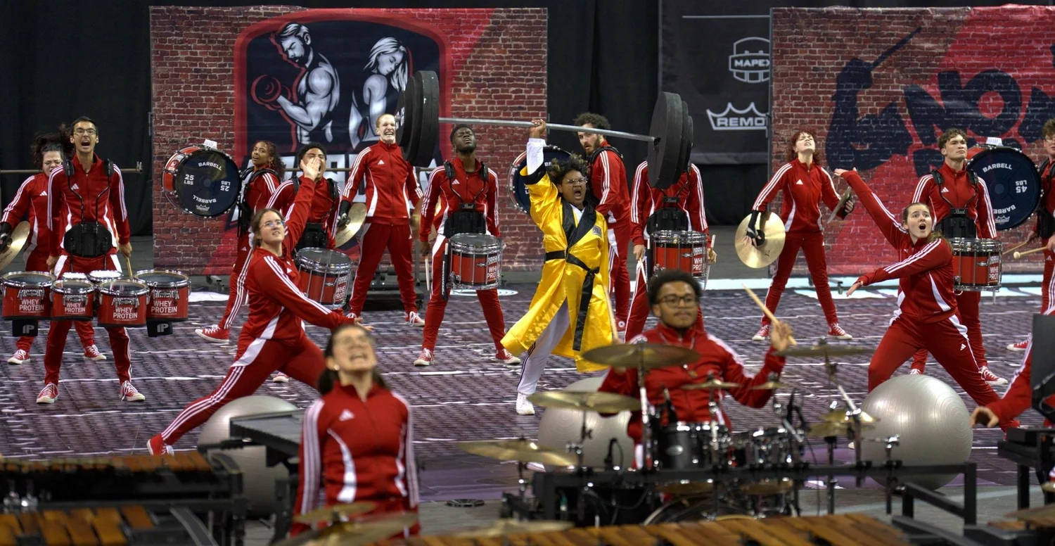 Paradigm Percussion performing a gym-themed indoor production.